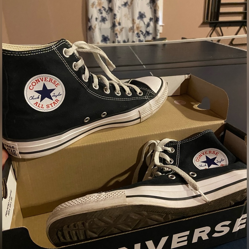 A pair of chuck taylors. Size 9.5 in women’s.
